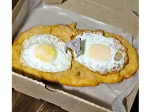 Milanesa a caballo de El Trebol