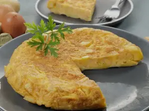 Tortilla de papas de Origen gastronómico