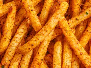 PORCIÓN DE PAPAS FRITAS SAZONADAS de TOM'S BURGER